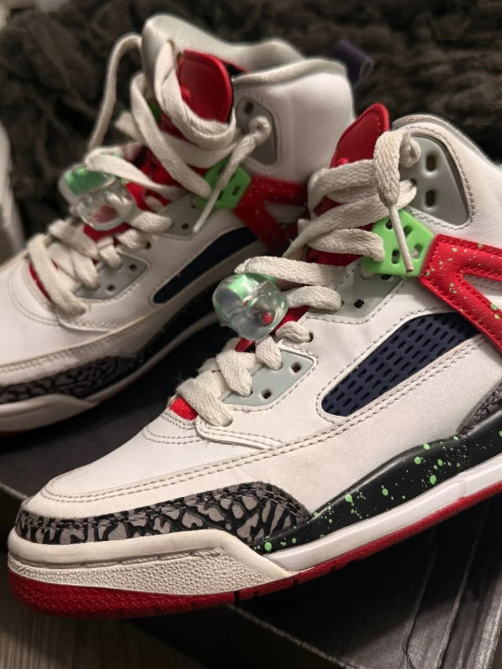 Air Jordan Spizike sneakers in white, red, and green.